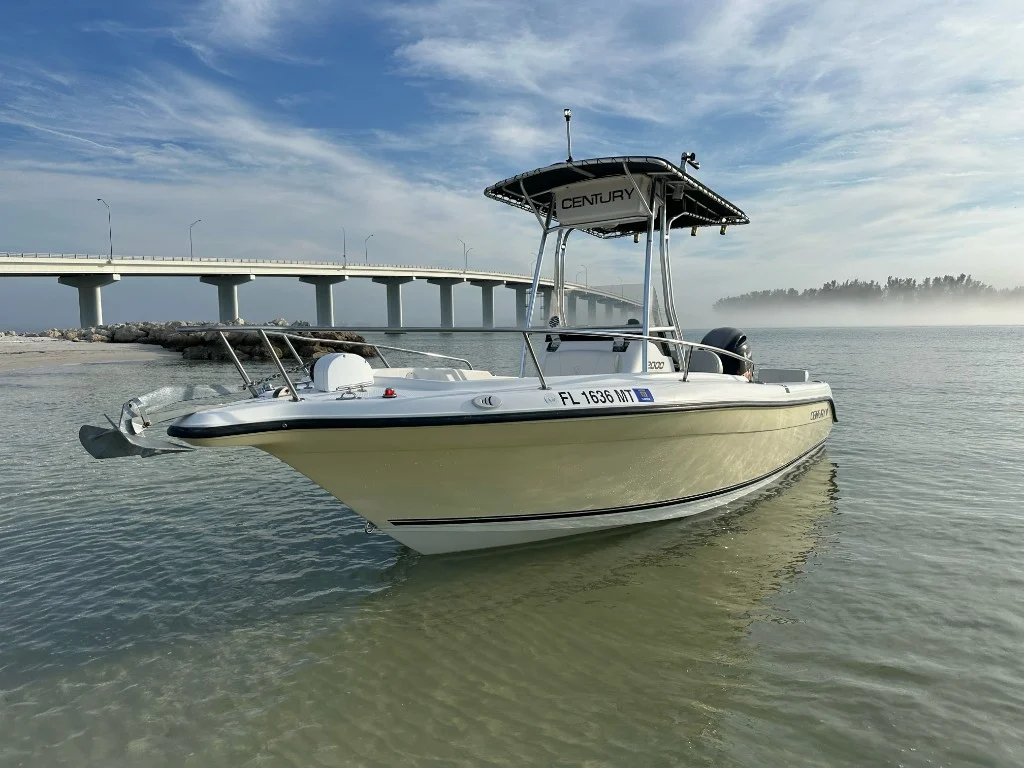 Previously sold fishing boat near a Florida bridge