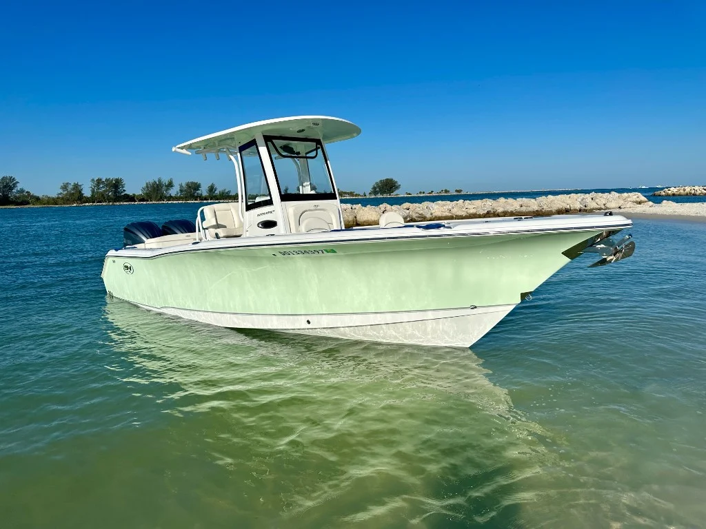 Previously sold center-console boat in clear coastal water
